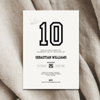 10th Birthday party invitation card with number 10 on a textured fabric background