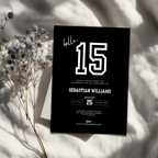 Black 15th birthday invitation card with white text on a light background