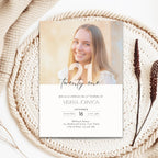 21st birthday invitation card with a photo of a smiling person on a woven surface.