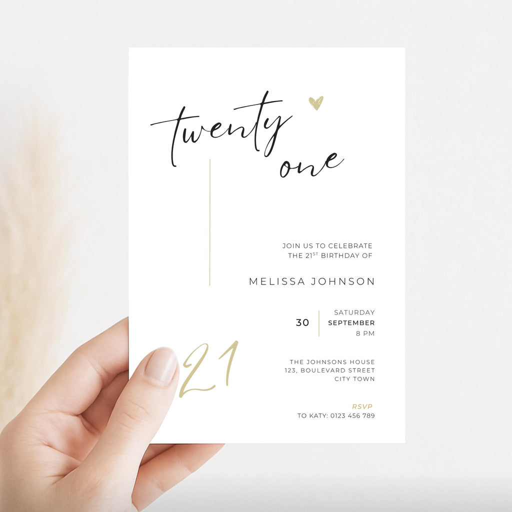 Hand holding a 21st birthday invitation card with gold and black text on a white background