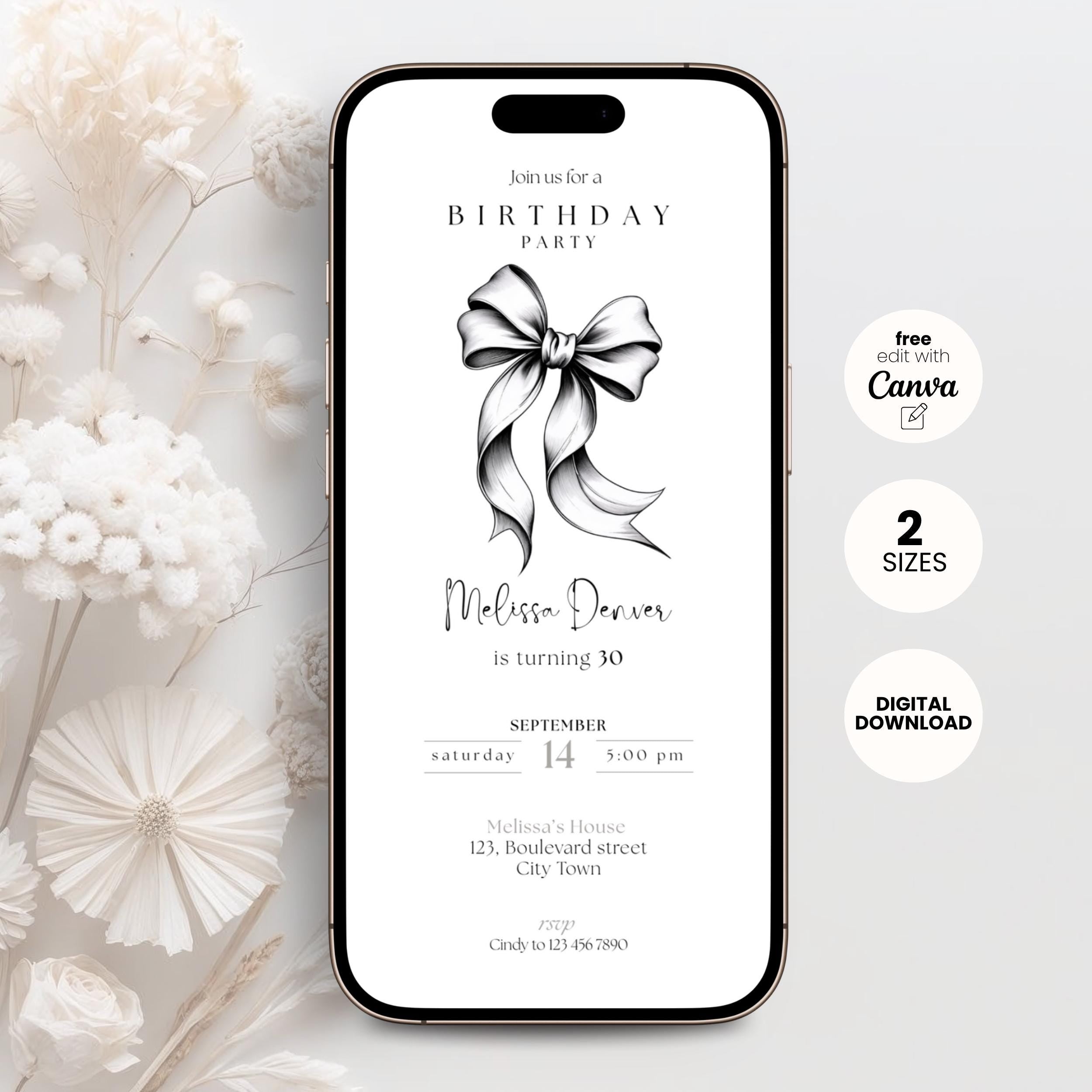 Phone screen displaying a 30th birthday party invitation with a black bow graphic, surrounded by white flowers on a light gray background.