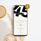 Phone displaying a 45th birthday invitation with a cup of coffee and decorative elements on a white surface.