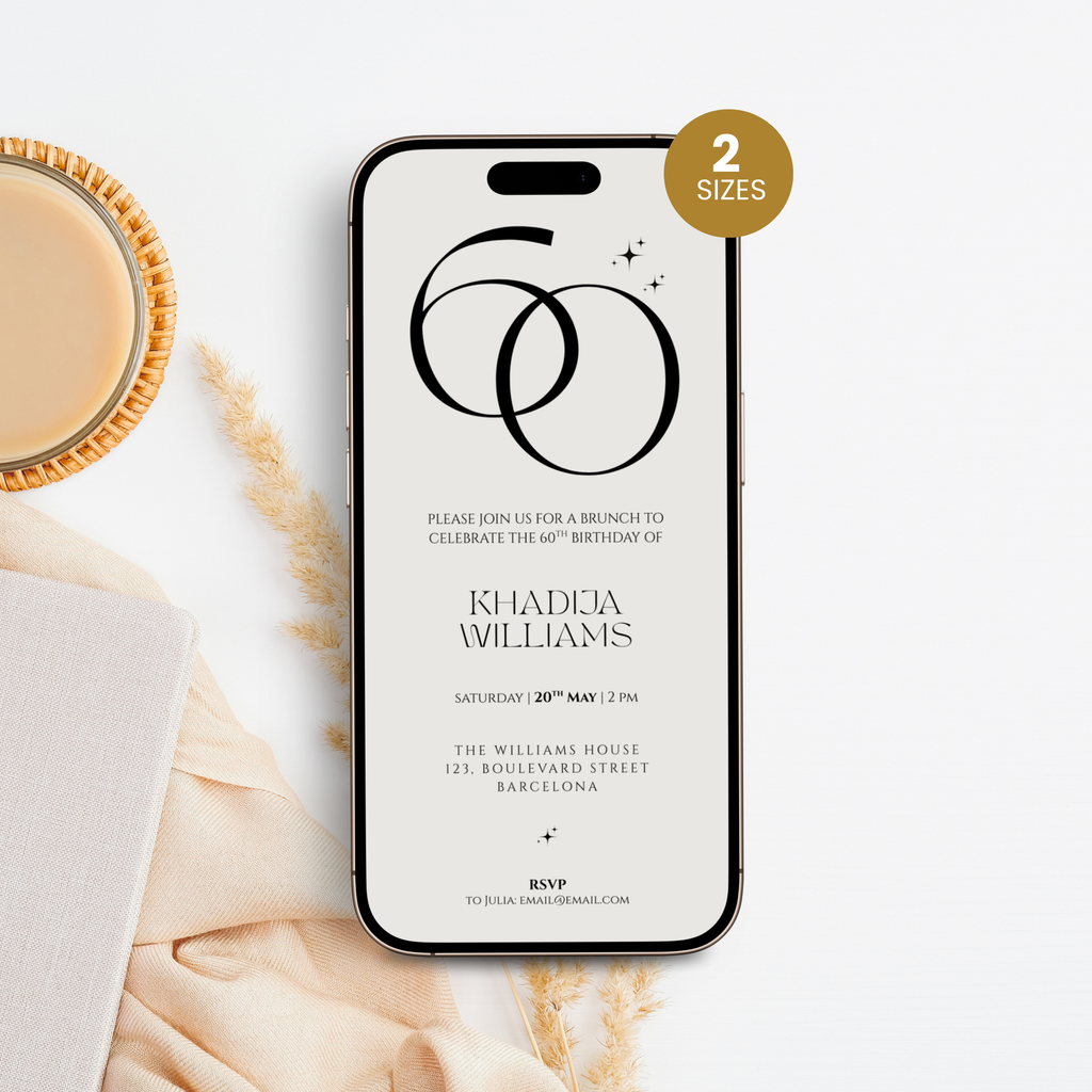 Phone displaying a 60th birthday invitation with a cup of coffee and decorative elements on a white surface