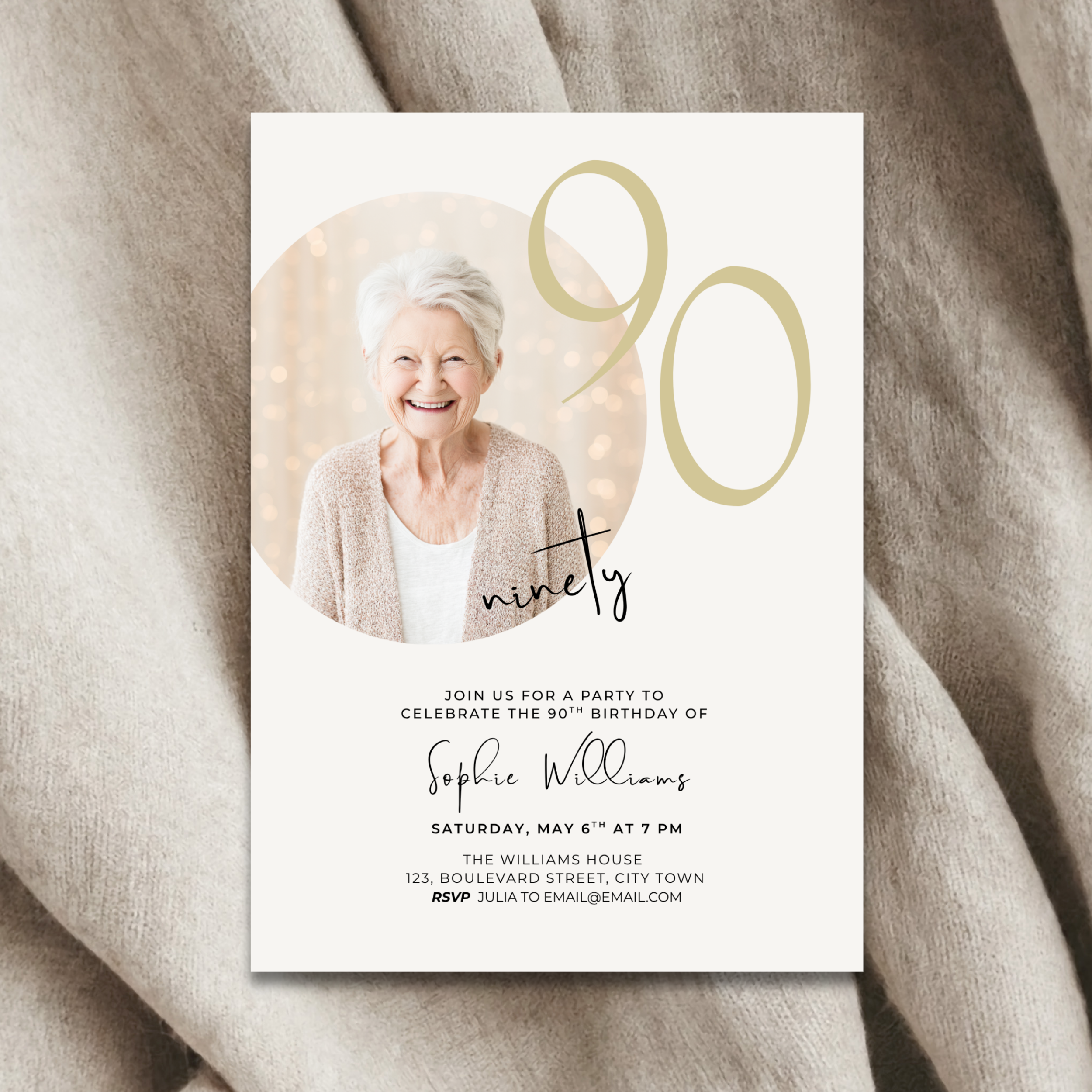 90th birthday invitation card with a photo of an elderly woman on a beige fabric background