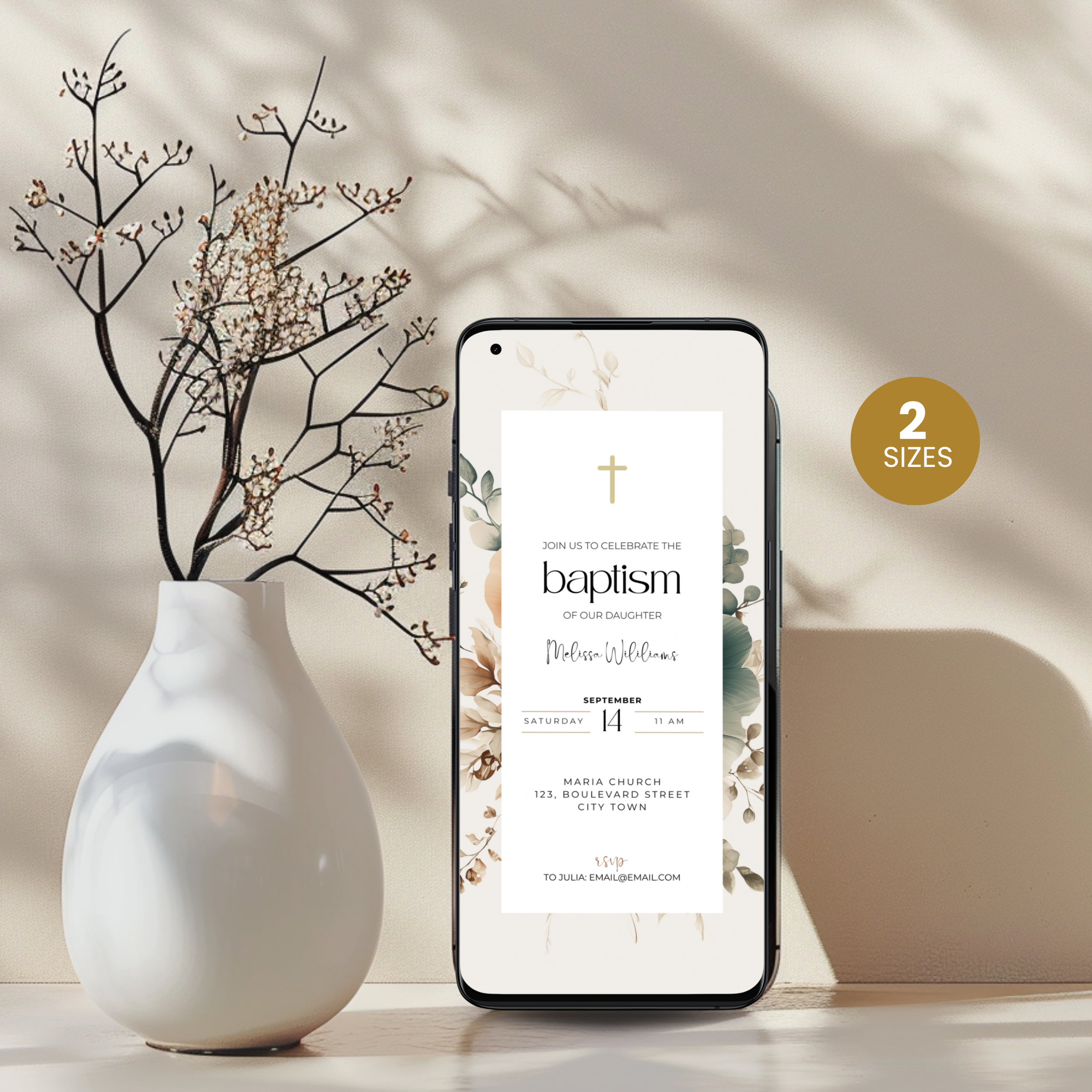 Phone displaying a baptism invitation with a white vase and branches on a light background