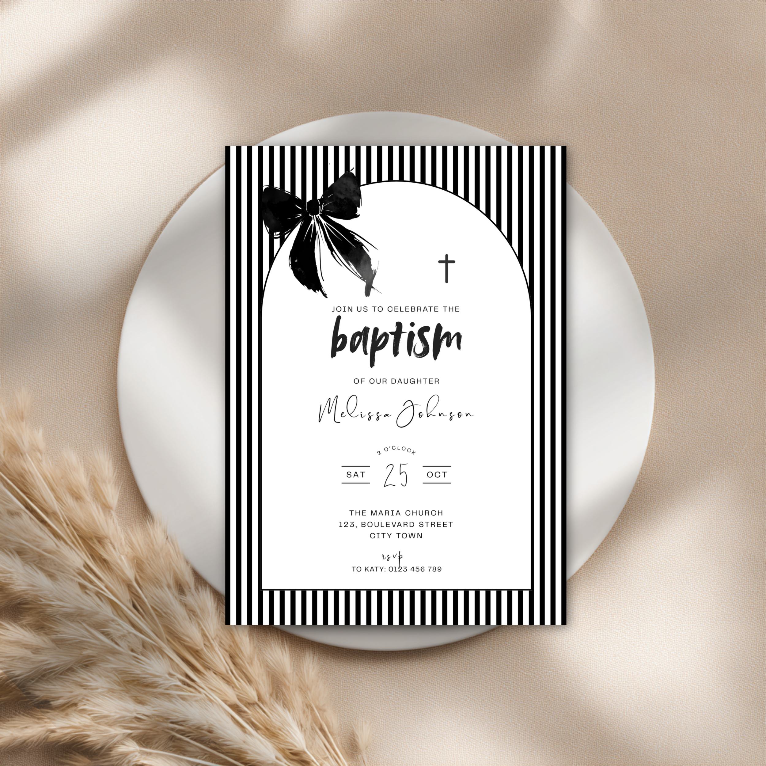 Baptism invitation card with black and white design on a beige background