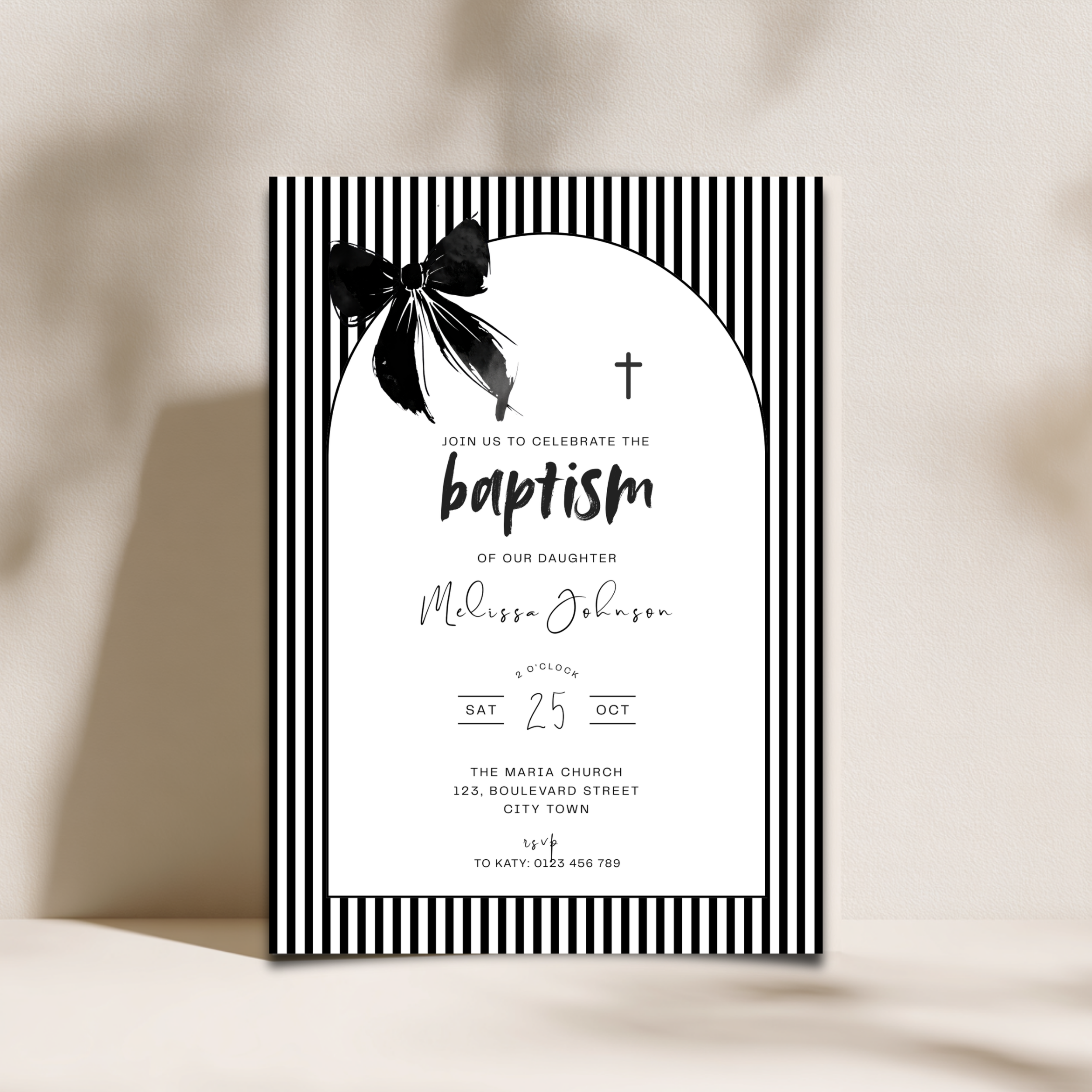 Baptism invitation card with black and white design on a beige background