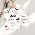 A Halloween little boo baby shower invitation set styled on a light surface with pink tulips. The main invitation card reads 'A Little Boo Is Almost Due' with cute ghost, bat, witch, and cupcake illustrations.