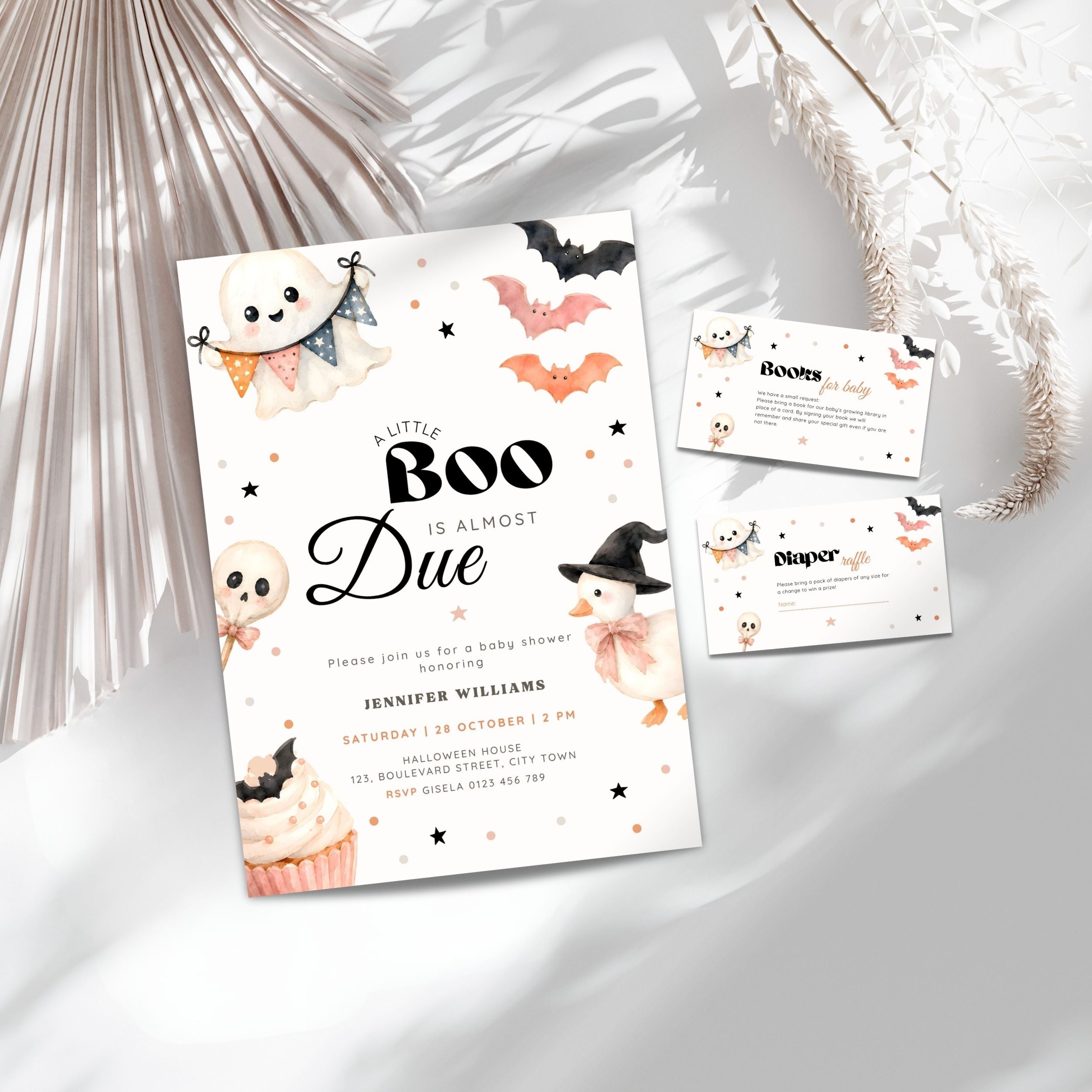 A Halloween little boo baby shower invitation set styled on a light gray surface with decorative dried palm leaves. The main card reads 'Plutus BOO is ALMOST Due' with ghost, bat, witch, and cupcake illustrations.