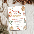 A festive Christmas-themed birthday invitation card styled in a flat-lay arrangement with a cozy beige knit sweater, pinecones, and evergreen branches on a soft white fabric background.