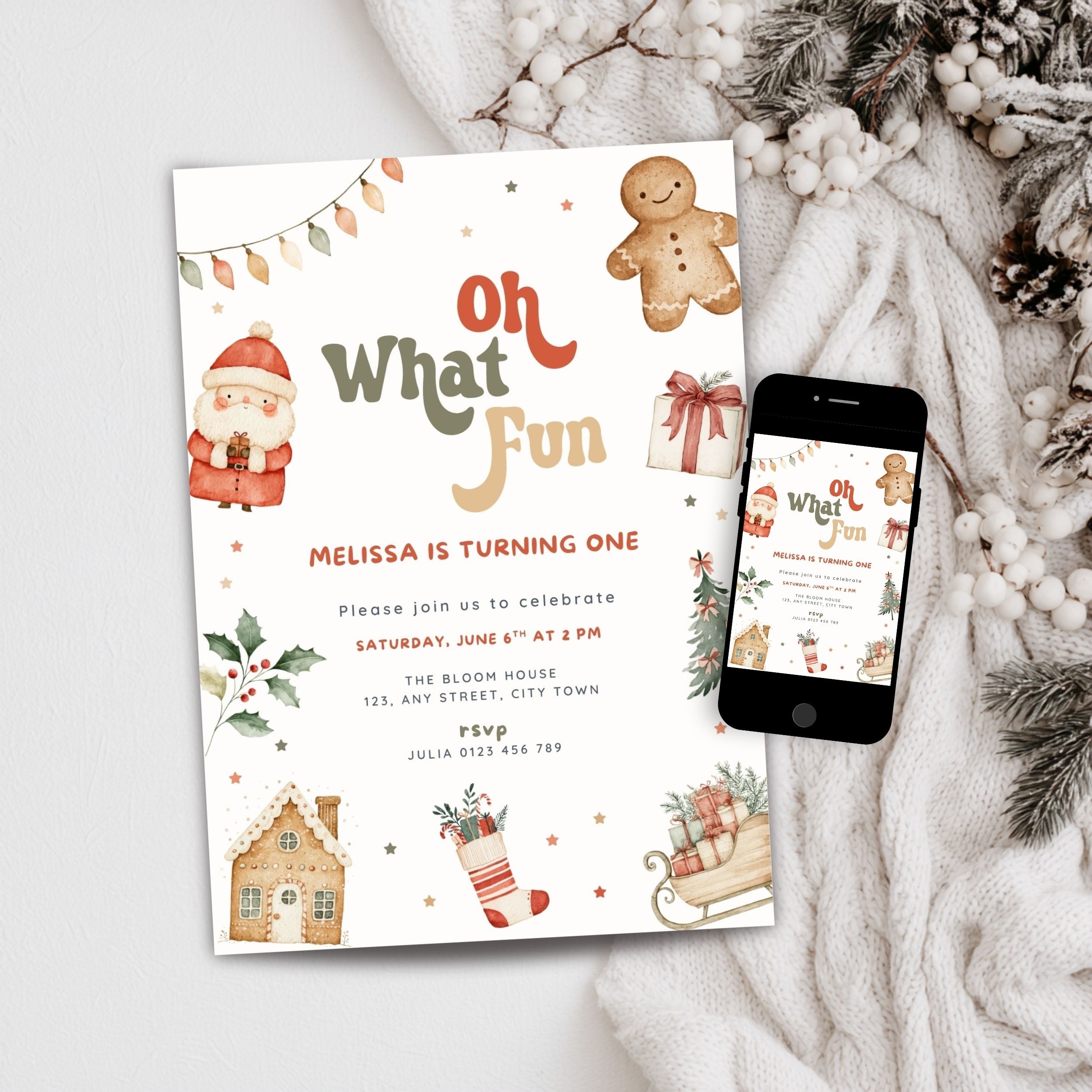 A festive Christmas-themed birthday invitation card is displayed next to a smartphone showing the digital version of the design. The card features cute illustrations of a gingerbread man, Santa Claus, a snowhouse, and a stocking on a warm off-white background, styled with a cozy knit blanket and winter greenery.