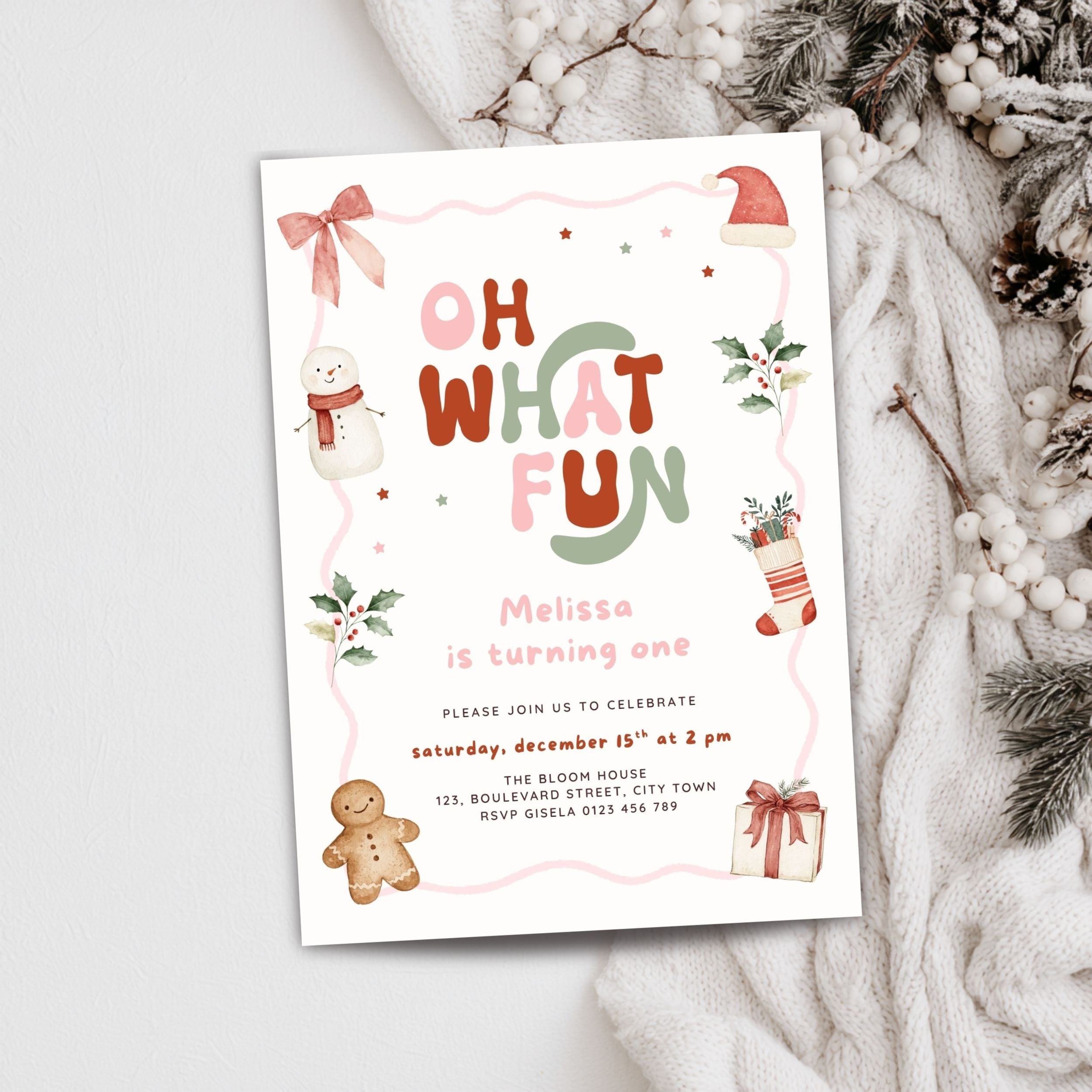 Christmas first birthday invitation for a girl featuring Oh What Fun lettering, watercolor snowman, gingerbread cookie, Santa hat, holly leaves, Christmas stocking, presents, pink bow, and festive holiday details. Digital download.
