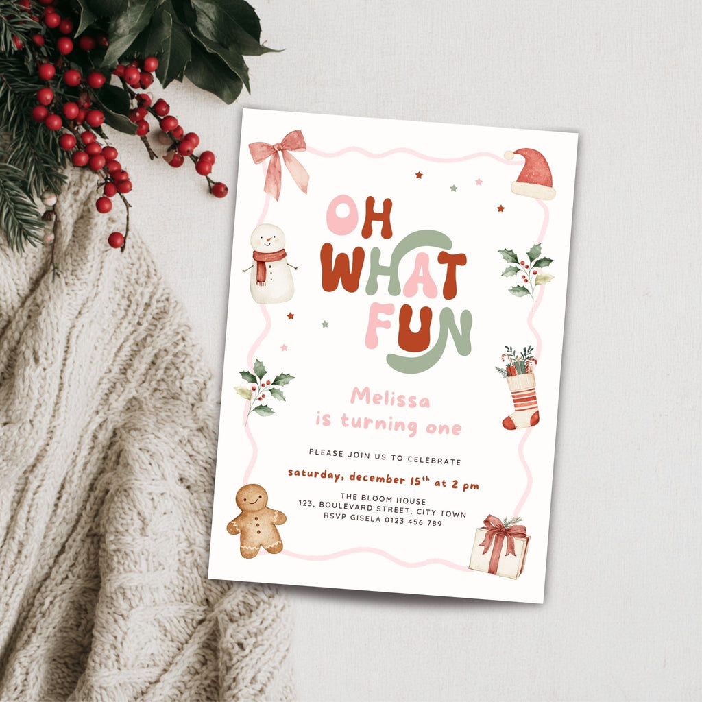 Christmas first birthday invitation for a girl featuring Oh What Fun lettering, watercolor snowman, gingerbread cookie, Santa hat, holly leaves, Christmas stocking, presents, pink bow, and festive holiday details. Digital download.