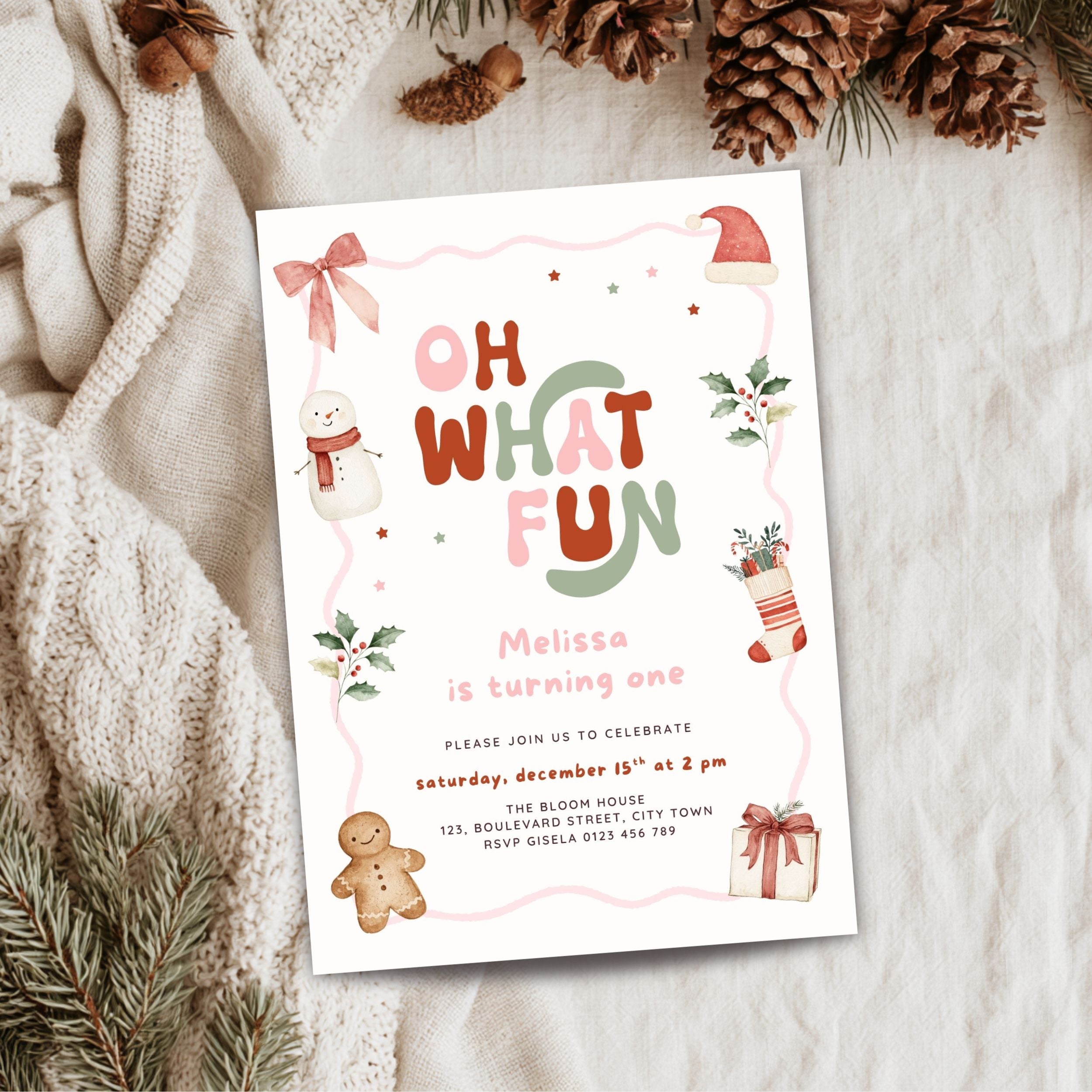 Christmas first birthday invitation for a girl featuring Oh What Fun lettering, watercolor snowman, gingerbread cookie, Santa hat, holly leaves, Christmas stocking, presents, pink bow, and festive holiday details. Digital download.