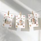 Christmas monthly photo banner featuring a baby photo in an arched frame, with a watercolor snowman, gingerbread cookie, Christmas stocking, Santa hat, holly, presents, and pink decorative border.