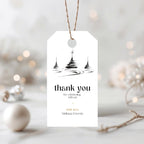 Minimal Christmas thank you gift tag template with a black tree illustration and twine loop, on a blurred holiday background
