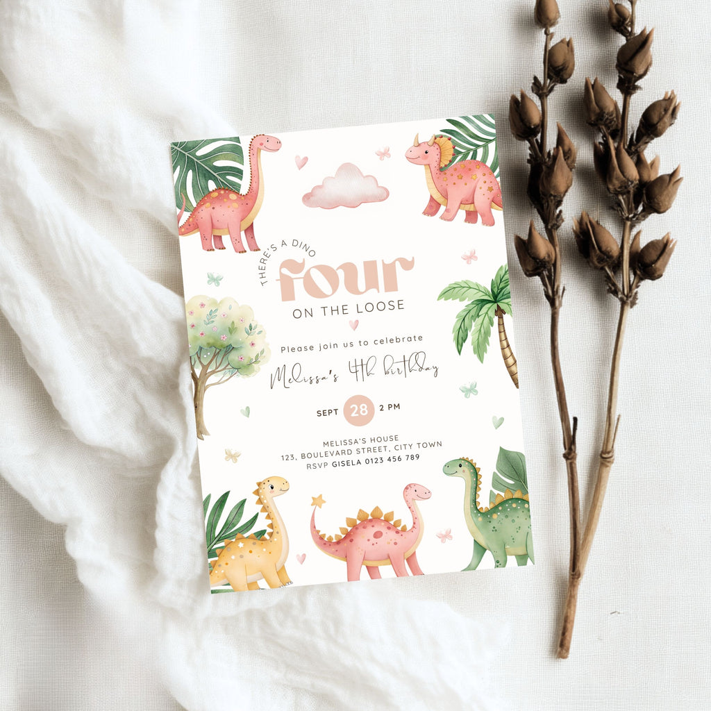 A children's 4th birthday invitation card styled in a flat lay on white fabric, accompanied by dried brown plant stems. The invitation features a whimsical dinosaur illustration design with pastel colors including pink, green, yellow, and orange on a white background.