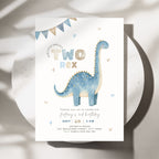 A children's 2nd birthday invitation card featuring a blue watercolor dinosaur on a white background, styled on a round white plate with soft shadows.