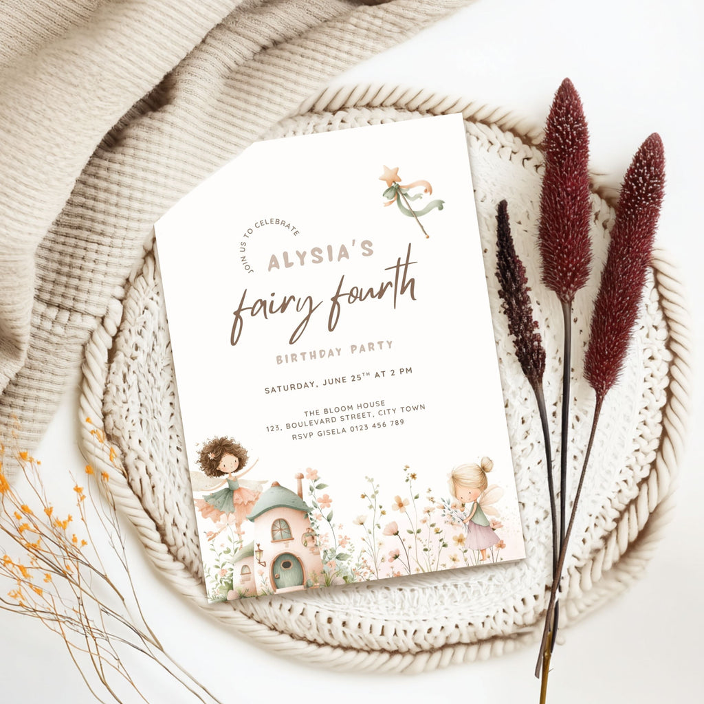 A styled flat-lay of a fairy-themed birthday party invitation card. The white invitation features elegant script text reading 'ALYRIA'S fairy fourth BIRTHDAY PARTY' and is decorated with whimsical illustrations of fairies, a cottage, and pastel flowers.