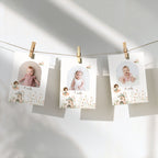 Three personalized baby milestone photos clipped to a string against a sunlit white wall, with soft shadows and delicate floral illustrations on the cards.