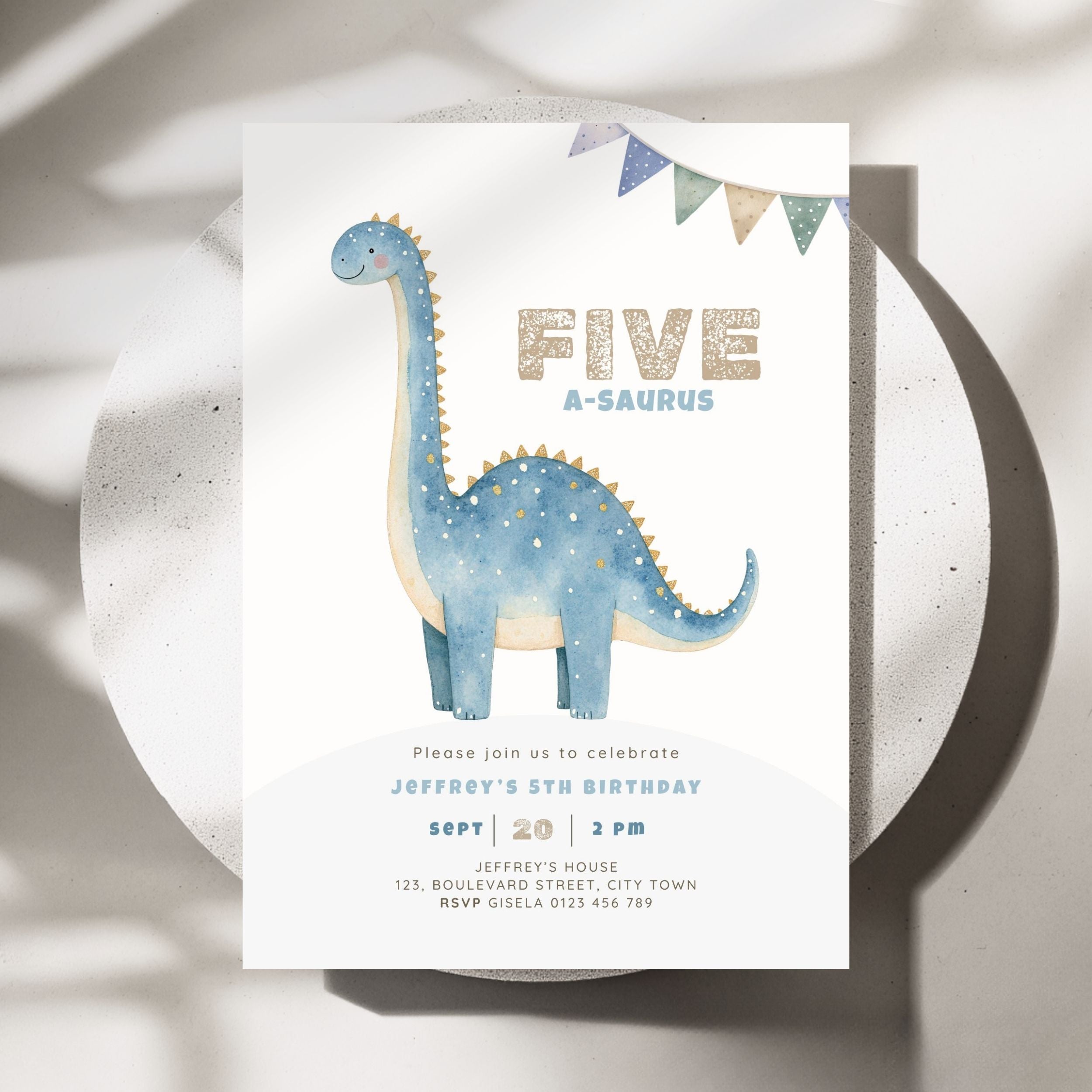 A children's 5th birthday invitation card featuring a blue watercolor long-neck dinosaur and the text 'FIVE A-SAUROS' in gold glitter-style lettering, styled on a round white tray with soft shadows.