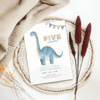 Close-up of dinosaur illustration on 5th birthday invitation for boys