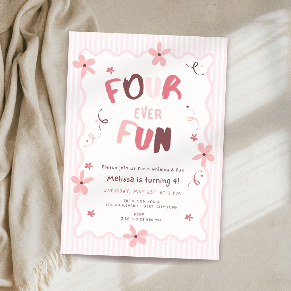 A pastel pink and white striped 'Four Ever Fun' 4th birthday invitation card styled on a beige fabric surface next to a cream-colored throw blanket.