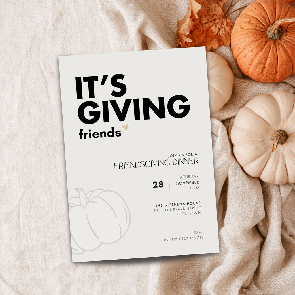 Bold typography Friendsgiving invitation template reading It's Giving friends, flat lay with pumpkins and dried leaves