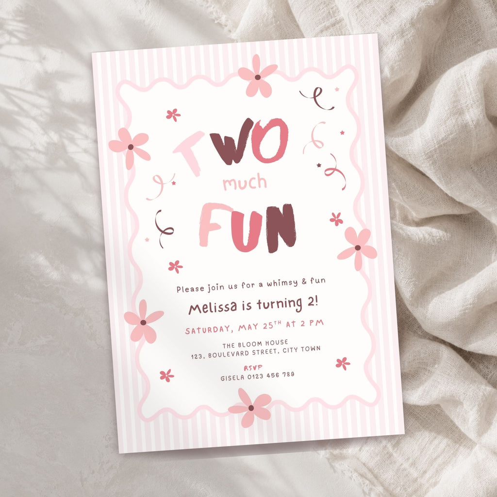 A pink and white striped children's birthday invitation card with floral illustrations and the text 'Two much FUN,' styled on a soft beige fabric background.