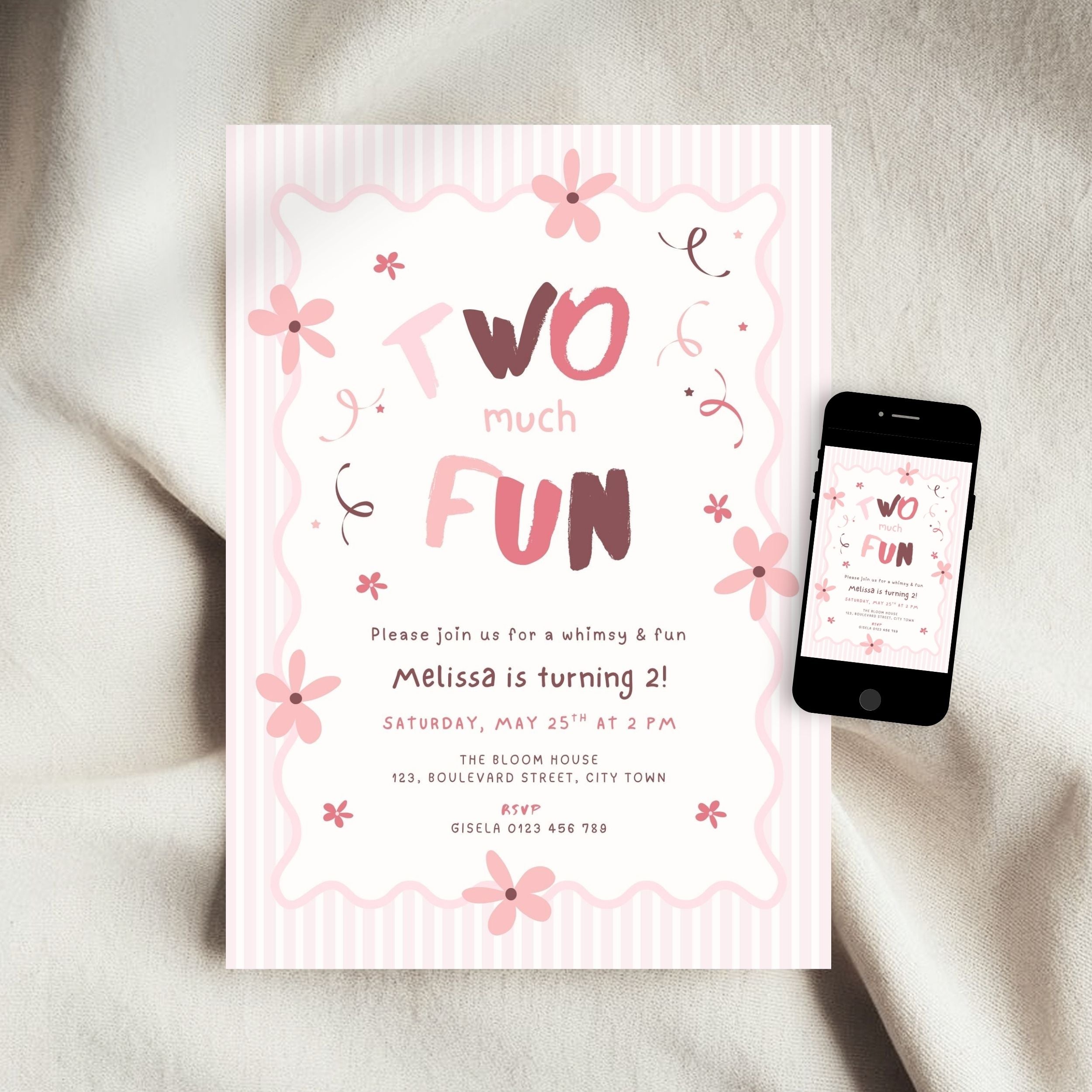 A pink and white striped invitation card with floral illustrations and the text 'Two much FUN' is shown on a soft beige fabric background, alongside a black smartphone displaying the same invitation design.