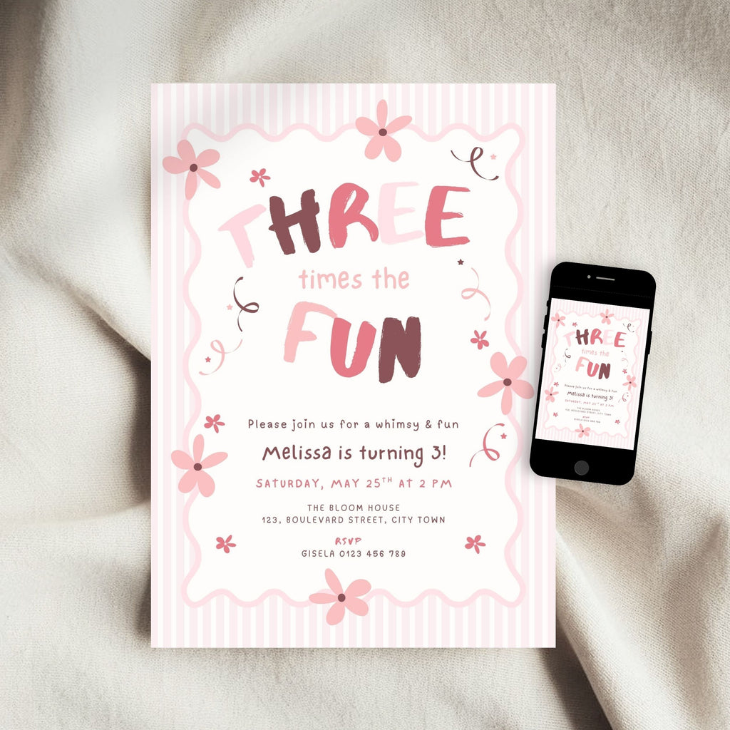 A pink and white striped birthday invitation card with floral illustrations and the text 'THREE times the FUN' is displayed on a soft beige fabric surface next to a smartphone showing the same design.