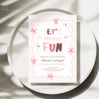 A pink and white birthday invitation card with cute floral doodles and the text 'LET'S HAVE SOME FUN' and 'Melissa is turning 8!', styled on a round speckled tray with soft leaf shadows.