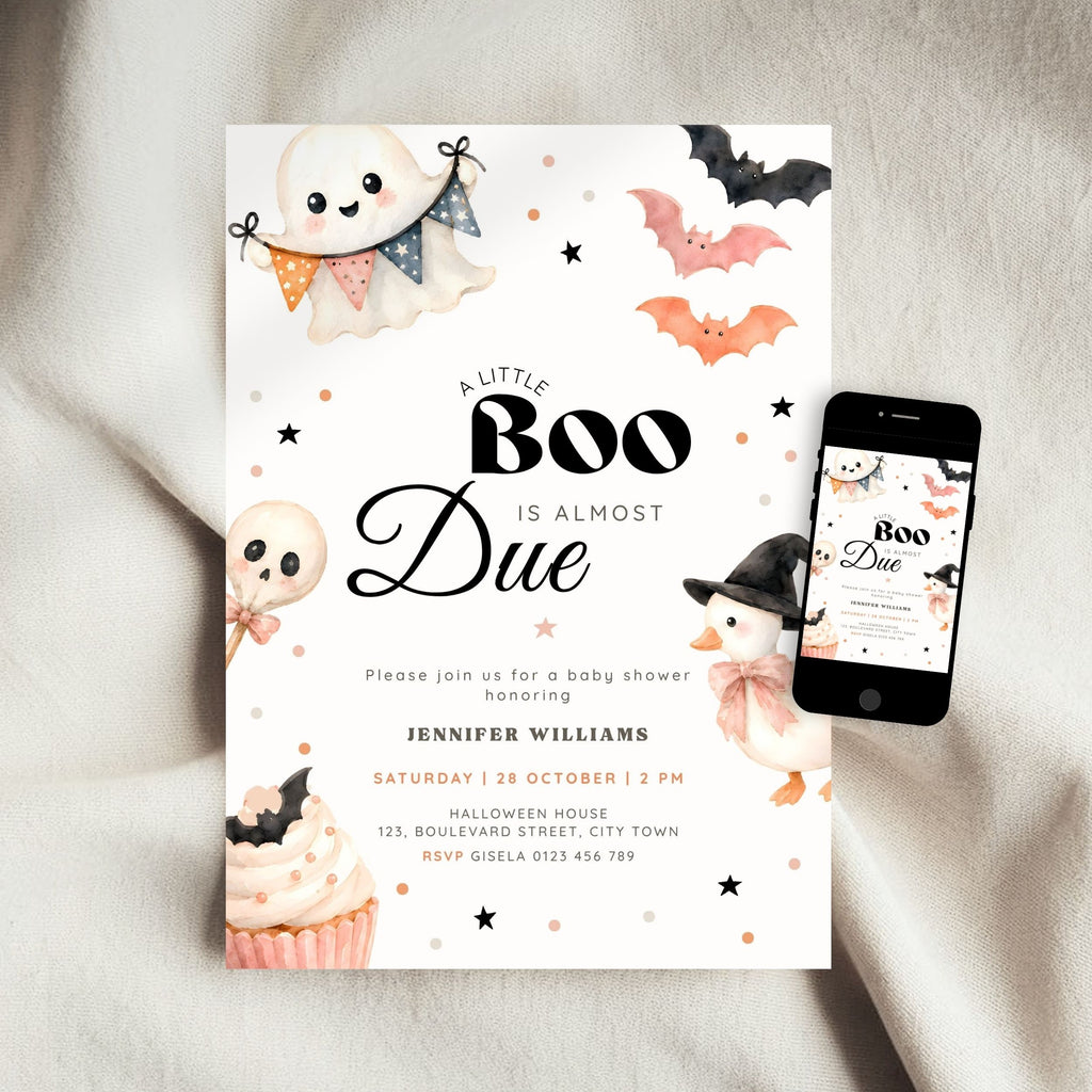 A Halloween little boo baby shower invitation card with cute ghost, bat, skull, and cupcake illustrations, shown on a white fabric background next to a smartphone displaying the same design.
