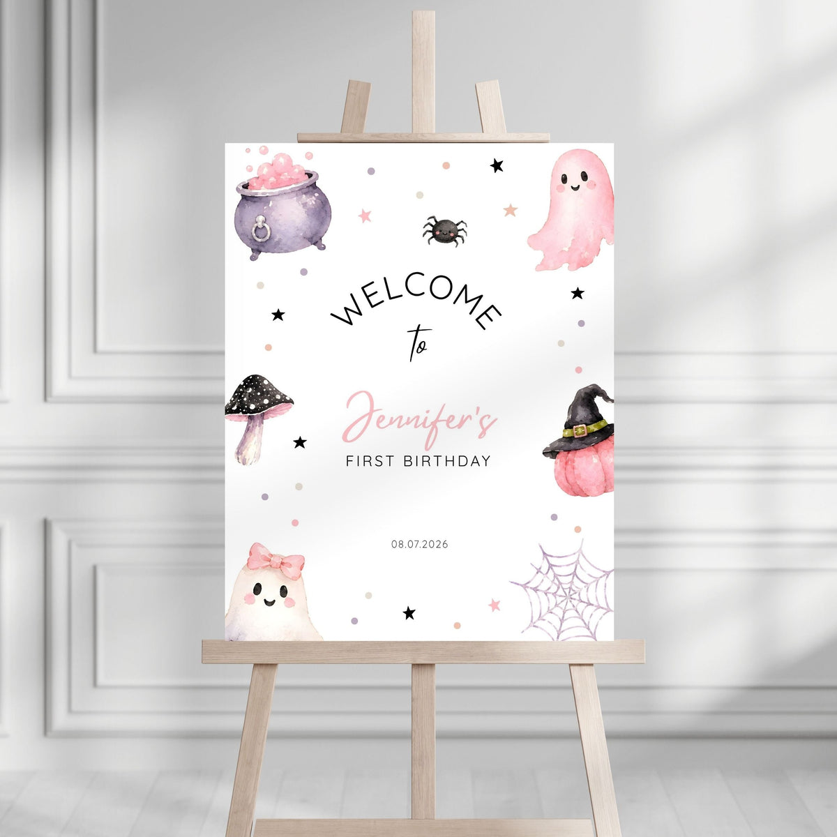 Pink Halloween 1st birthday welcome sign shown at party entrance