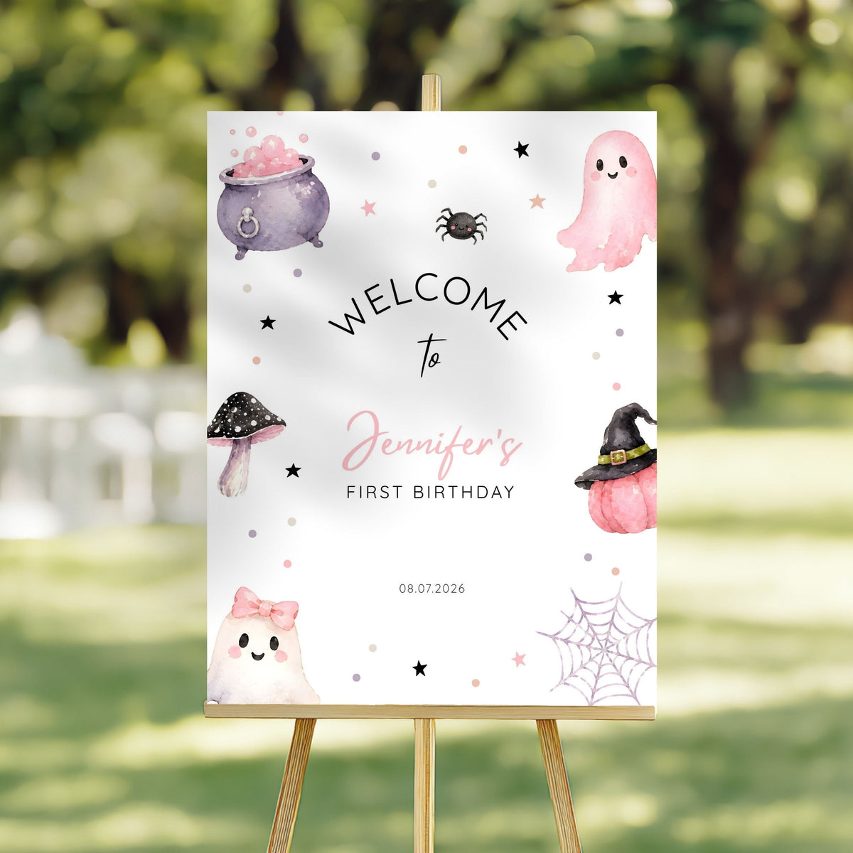 Close-up of pink ghost and cauldron design on 1st birthday welcome sign