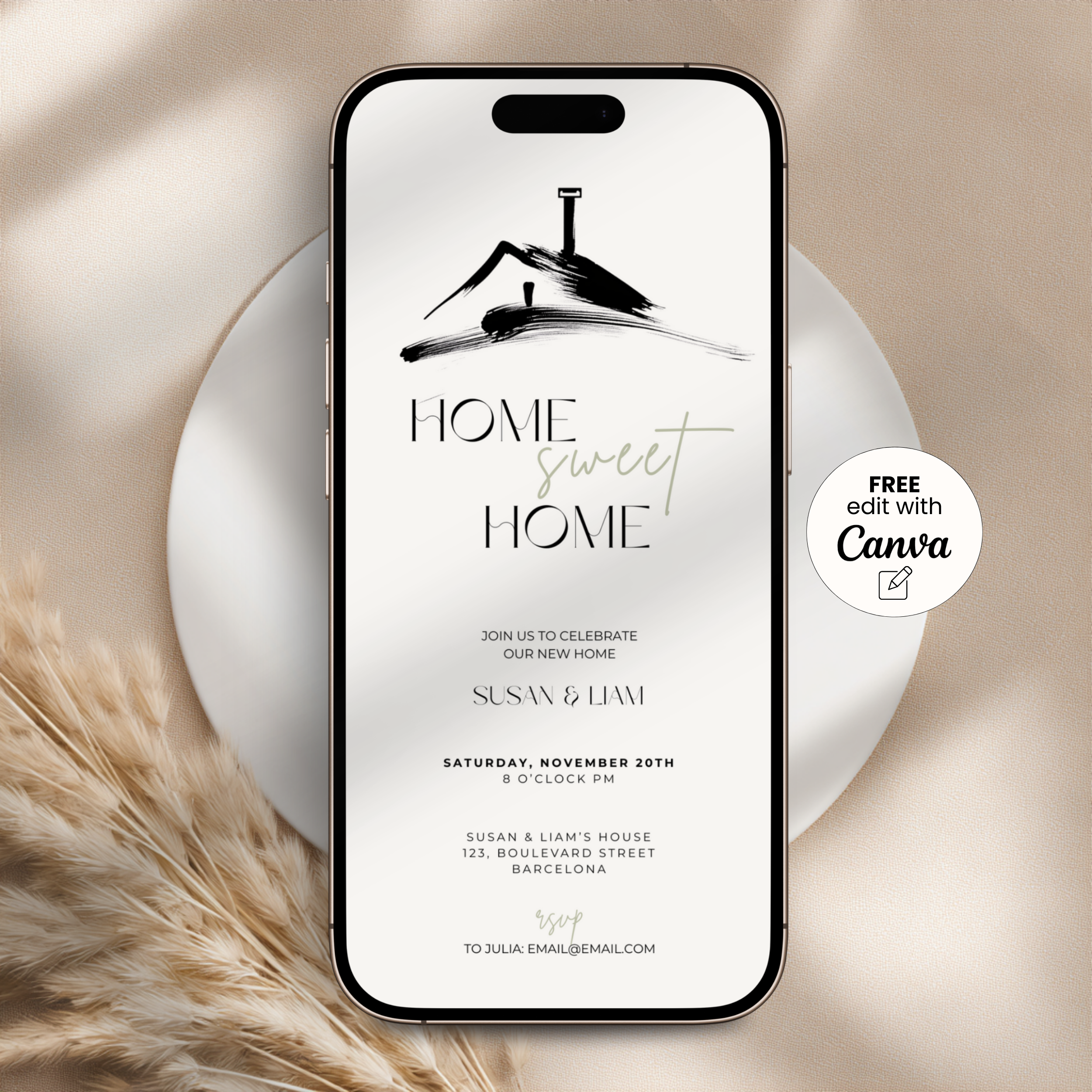 Phone displaying a 'Home Sweet Home' housewarming invitation on a beige background with pampas grass.