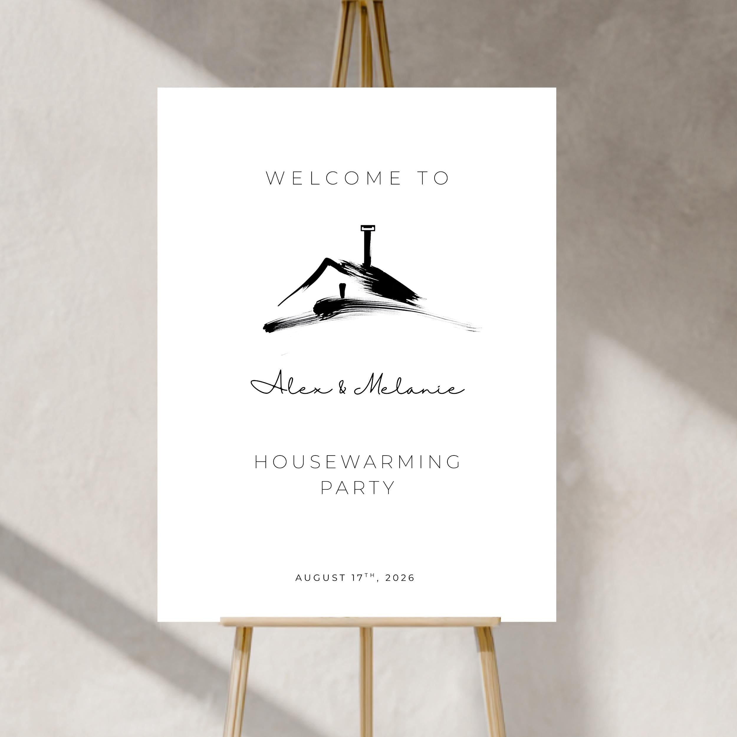 Housewarming party invitation with a black silhouette of a house on a white background, displayed on an easel.