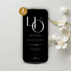Phone with a 40th birthday invitation on a light gray background with white flowers