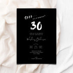 Black 30th birthday invitation card with white text on a white fabric background