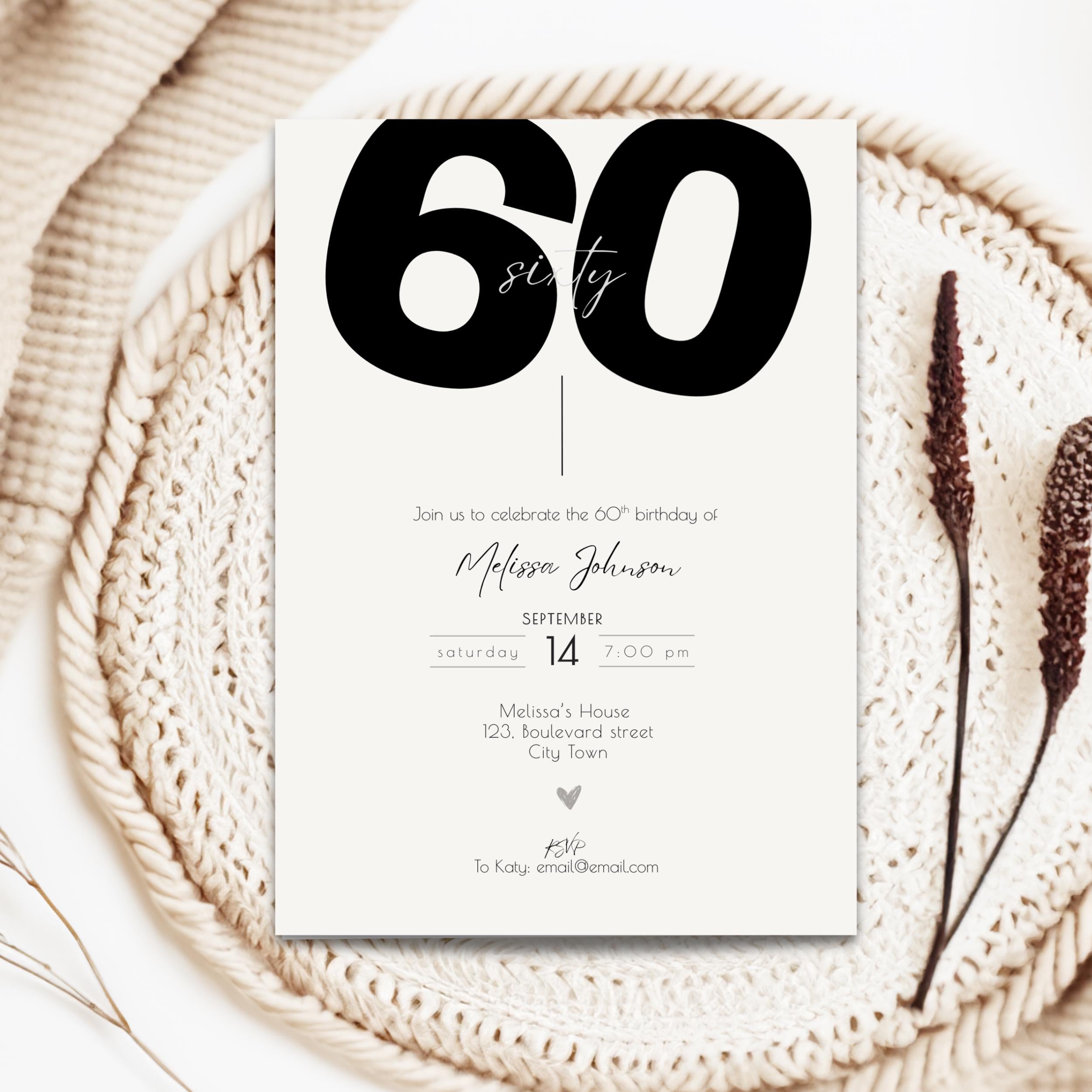bold 60th birthday invitation card on a textured surface with decorative elements
