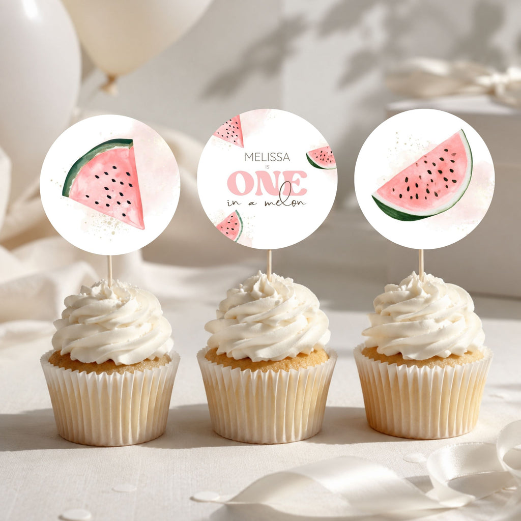 Three watermelon-themed cupcake toppers displayed on top of frosted cupcakes. The center topper is a round white design with the text 'MELISSA ONE in a melon' and small watermelon illustrations, while the side toppers are semi-circular watermelon slices with green rinds and pink flesh.