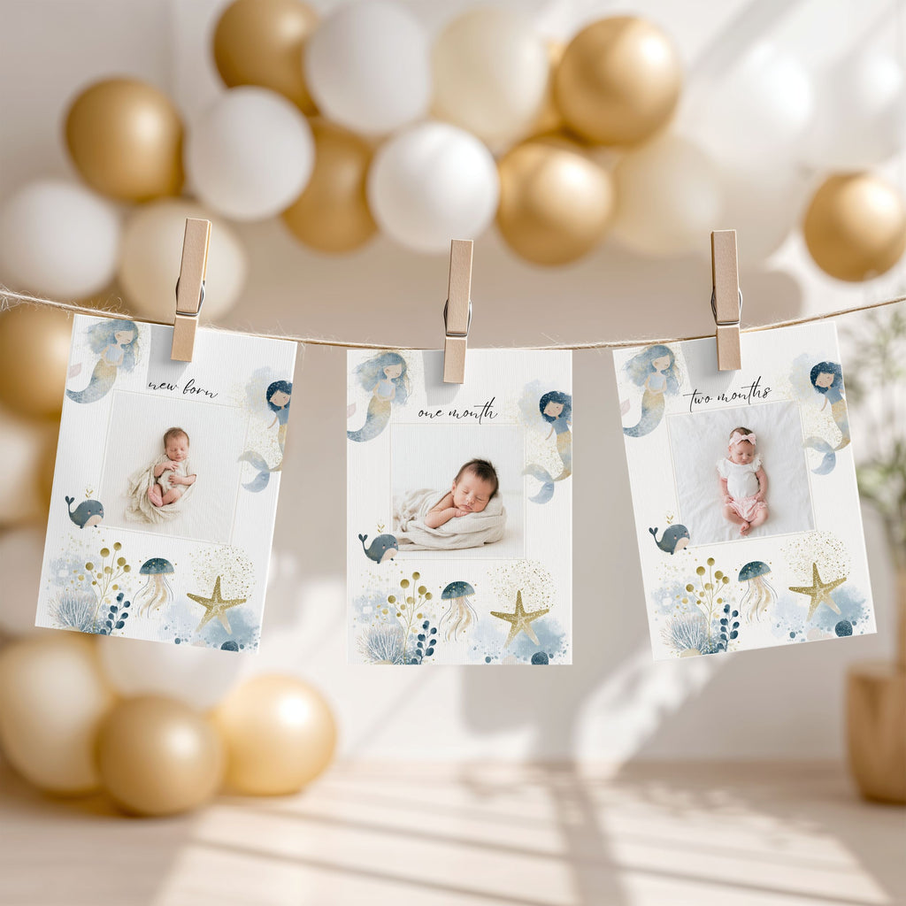 Three personalized baby milestone photo prints clipped to a string banner, displayed in a soft, decorated nursery setting with gold and white balloons in the background.