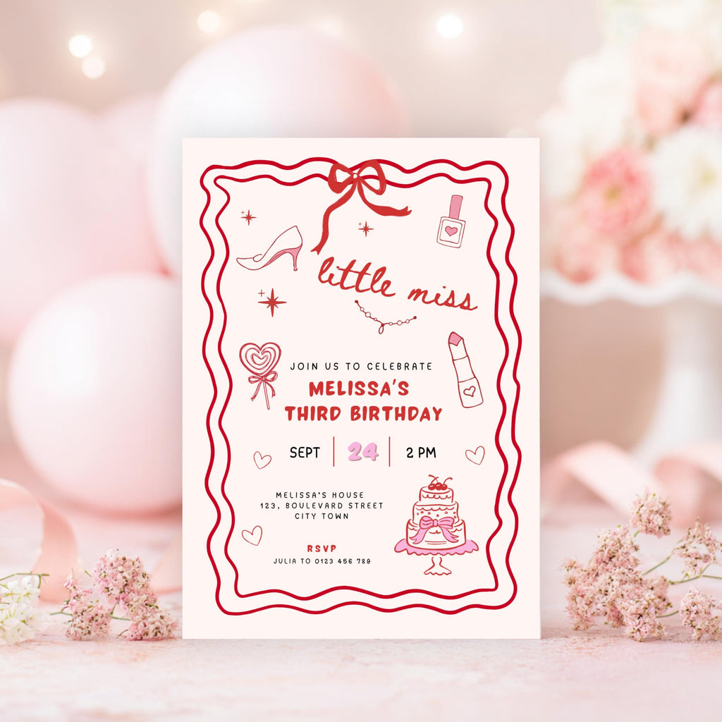 Birthday invitation card with red border and pink decorations on a blurred background