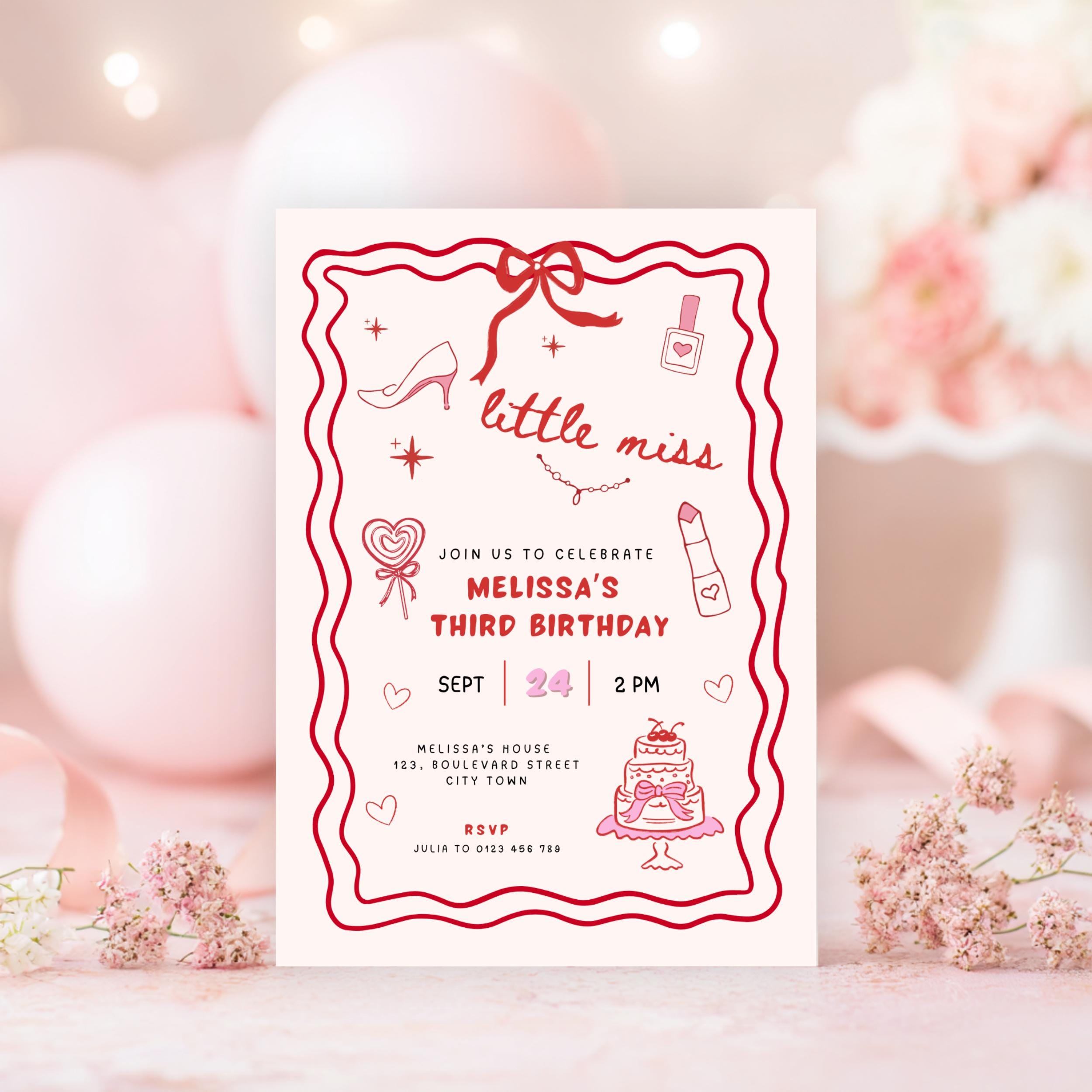Birthday invitation card with red border and pink decorations on a blurred background