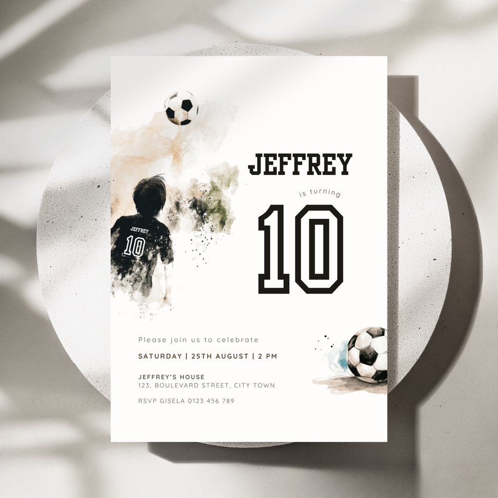A soccer-themed 10th birthday invitation card for a 10-year-old boy named Jeffrey, styled on a white plate with soft shadows. The card features a watercolor soccer player, two soccer balls, and bold black text.