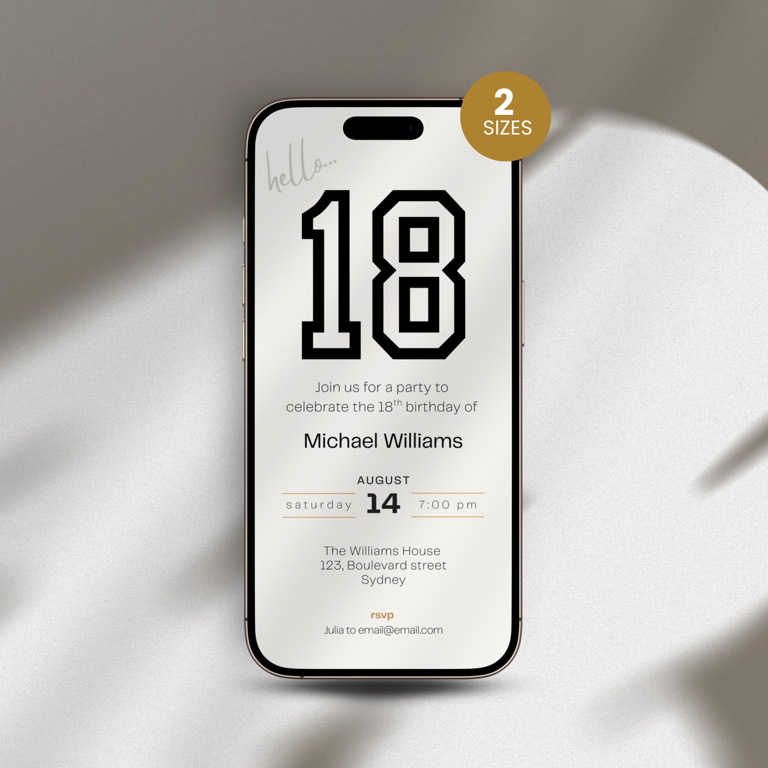 Phone with 18th birthday invitation on a white surface