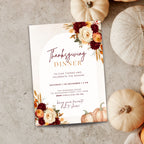 Thanksgiving dinner invitation template with burgundy and orange floral arrangements, pumpkins, wheat accents, elegant typography, and autumn-inspired details on a cream background.