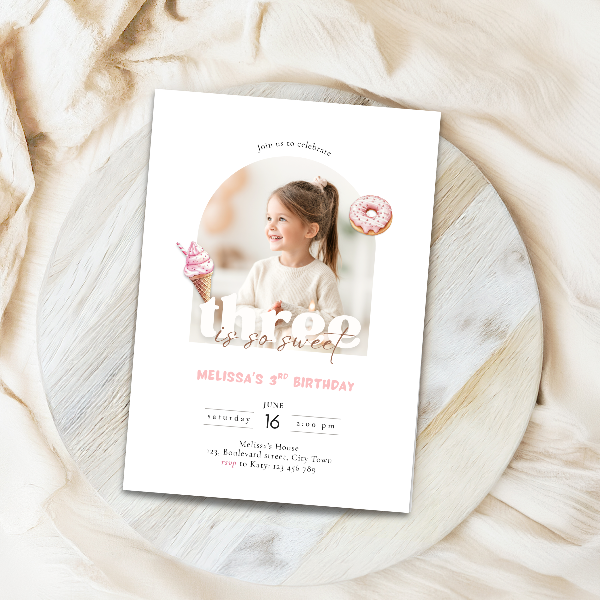Birthday invitation card with a child and donut design on a textured surface