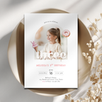 3rd Birthday invitation card with a photo of a girl holding an ice cream cone, placed on a decorative surface with flowers.