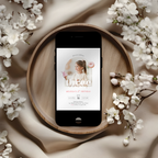 Phone displaying a 3rd birthday invitation on a wooden plate with white flowers